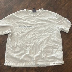 “how spring bursts into summer” white T-shirt.